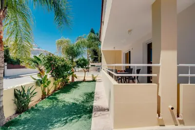 a view from the balcony of a house with palm trees at Apartment Helena in Ayia Napa