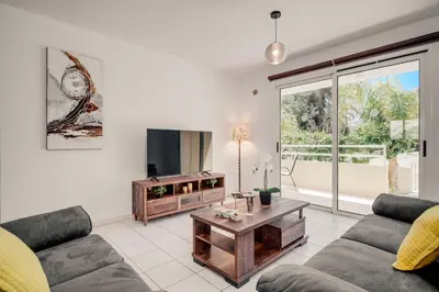 a living room with a couch and a table at Apartment Helena in Ayia Napa