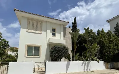 a white house with a fence in front of it at Zoe's villa by Turtle Bay in Protaras