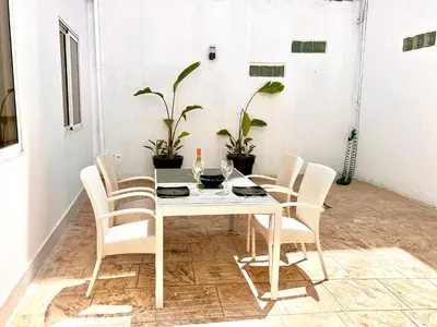 a white table and chairs in a room at Stasinou 52 in Limassol