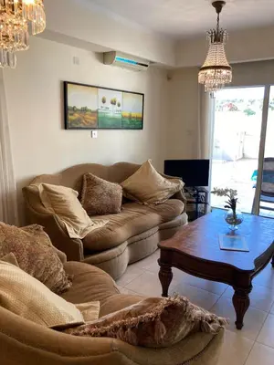 a living room with a couch and a coffee table at Anna Villa in Protaras