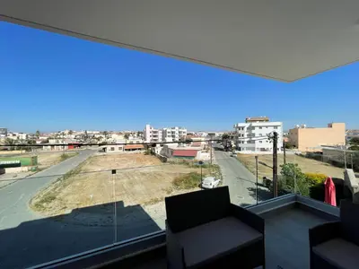 a large window with a view of a city at Unforgettable Experience in a Modern Apartment! in Larnaka