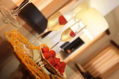 two spoons with strawberries on top of a cake at A three-bedroom villa with a private pool and landscaped garden Wi-Fi in Pissouri