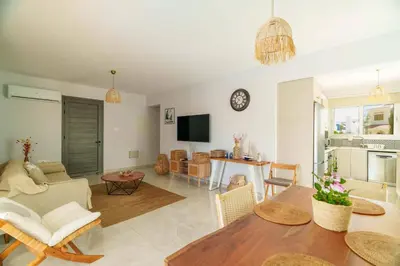 a living room with a table and a dining room at Geo Panoramic Villa Konnos - Pool, Game Room, Gym in Protaras