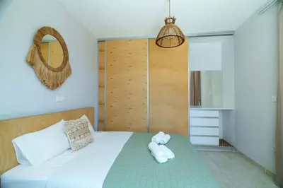 a bedroom with a bed with a stuffed animal on it at Geo Panoramic Villa Konnos - Pool, Game Room, Gym in Protaras