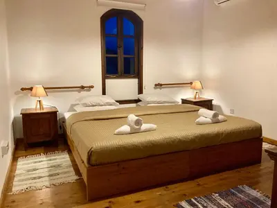 a bedroom with two beds with towels on them at Traditional House with Mountain View - Dierona Village in Dierona