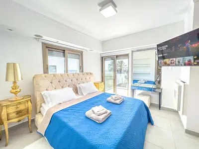 a bedroom with a bed with towels on it at Erato Seafront Luxury Villa in Protaras