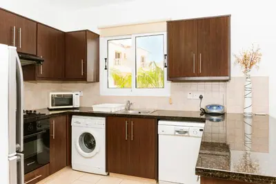 a kitchen with a sink and a dishwasher at VILLA ICARUS IN THE HEART OF PROTARAS in Protaras