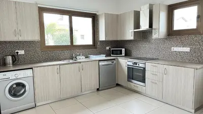 a kitchen with a sink and a dishwasher at Merab Holidays Villas - K13 in Ayia Napa