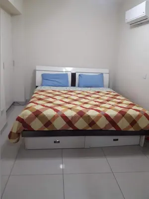 a bedroom with a bed in a white room at Nicosia City Centre Apartment in Nicosia