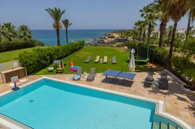 a swimming pool with a view of the ocean at SunnyVillas: 4BR SeaFront Villa*Private Pool*BW44 in Protaras