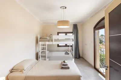 a bedroom with two bunk beds and a window at SunnyVillas: 4BR SeaFront Villa*Private Pool*BW44 in Protaras