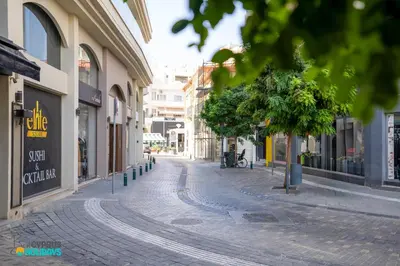 a cobblestone street in a city with buildings at Lemon Paradise City centre 200m from beach in Larnaka