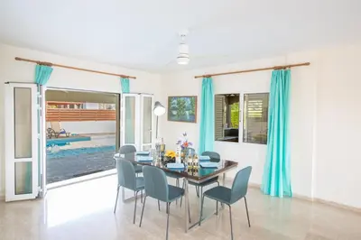 a dining room with a table and chairs at Papaya Royal Villa in Ayia Napa