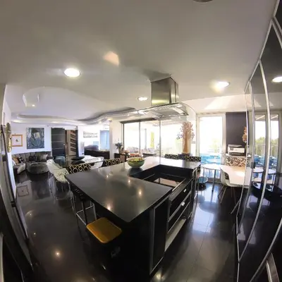 a kitchen with a black island in a room at The View Beach Penthouse in Limassol