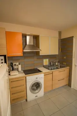 a kitchen with a washing machine and a washer at Mezzarina apartment ayia napa in Ayia Napa