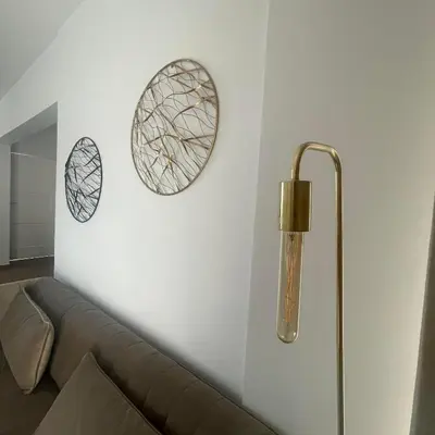 a living room with a couch and two mirrors on the wall at Glamorous, Renovated 3-Bedroom Apt in Nicosia in Nicosia