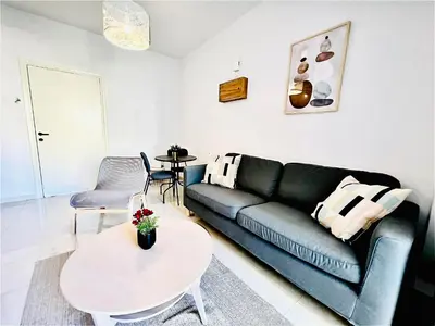 a living room with a couch and a table at LINA 25 in Larnaka