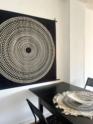 a room with a table and a wall with a picture at 1BDR Affortable and Cozy Stay in Nicosia - Ioanni Polemi By Platform 357 in Nicosia
