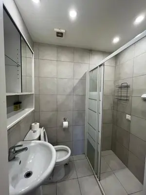 a bathroom with a toilet and a sink and a shower at 1BDR Affortable and Cozy Stay in Nicosia - Ioanni Polemi By Platform 357 in Nicosia