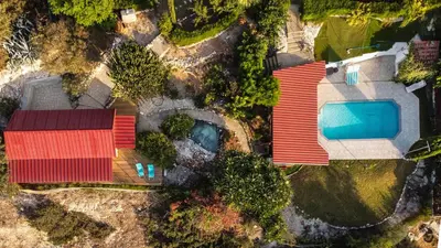 an overhead view of a house with a swimming pool at Sunset Retreat Cyprus in Pendakomo