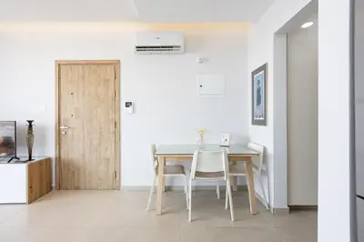 a dining room with a table and chairs at Rodoni Residence in Strovolos