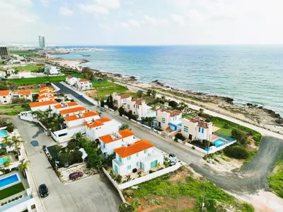 an aerial view of a town next to the ocean at Votsalo Villa - 30m from Med Sea in Ayia Napa