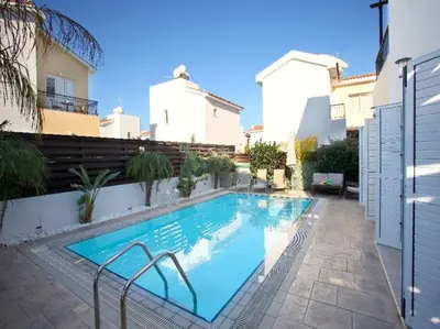 a swimming pool in front of a building at Villa Kos 19 in Protaras