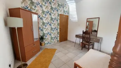 a living room with a desk and a mirror at Villa Christina in Protaras