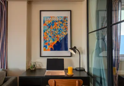 a desk with a laptop computer on top of it at Perfect for families, Beach 3 Min away, Brand New in Limassol