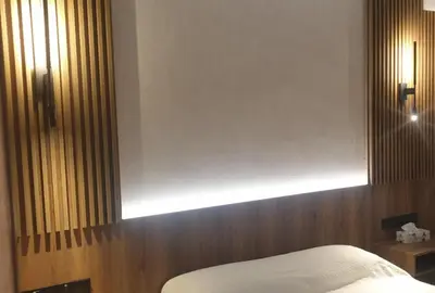 a bedroom with a bed with a light above it at New Smart Living-1 Bedroom Aglantzia, Nicosia in Aglantzia
