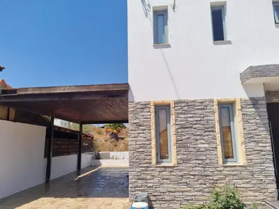 a renovation of a house with a stone facade at Tereza's House in Ayvaryara
