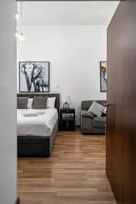 a bedroom with a bed and a couch at Cozy house city center in Limassol in Limassol