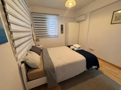 a small bedroom with a bed and a window at Nicosia Downtown Cozy in Nicosia