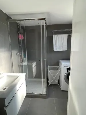 a bathroom with a shower and a toilet and a sink at Nicosia Downtown Cozy in Nicosia