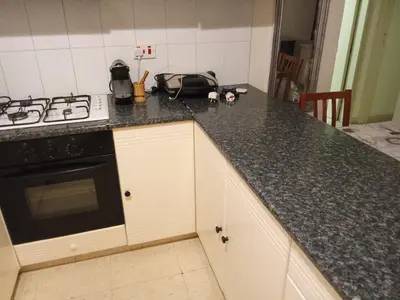 a kitchen with a stove and a counter top at 2 bedroom apartment in Makenzi in Larnaka