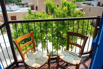 two chairs sitting on top of a balcony at To Archontiko tis Anastasias in Athienou