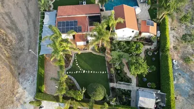 an overhead view of a house with palm trees at Oasis By The Sea - Cyprus in Larnaka