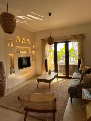 a living room with a couch and a table at Relaxing Gateway in Limassol in Episkopi Lemesou