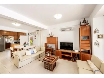 a living room with a couch and a table at Protaras Apollon Seaside Villa in Protaras