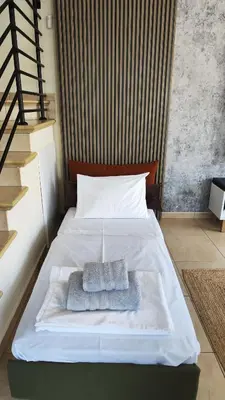 a white bed with a towel on top of it at My Mythical Pearl in Protaras
