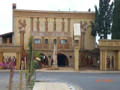 a large building with a balcony on a street at St. Lazaros Seaside Apartment in Larnaka