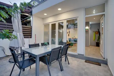 a dining room with a table and chairs at Oroklini Star 200metres from the sandy beach in Larnaka