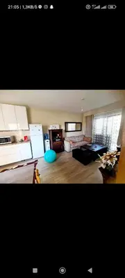 a living room with a couch and a table at Vicky apartment in Paralimni