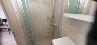 a bathroom with a shower with a toilet and a sink at Village Gem Peledri Studio in Pelendri