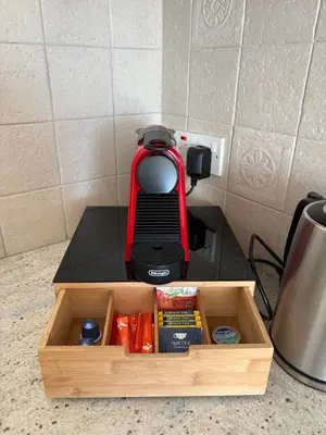 a wooden box with a red blender on a counter at Green Door Getaway in Limassol
