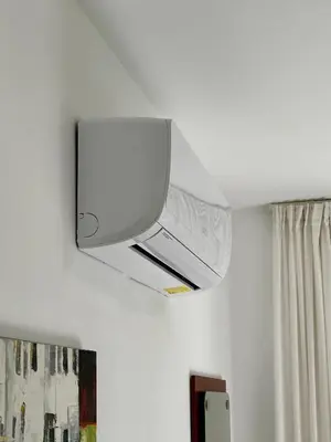 a tv on the ceiling of a room at Green Door Getaway in Limassol