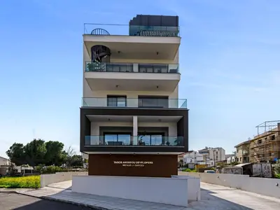 a building with balconies on the side of it at Sanders Triple in Limassol