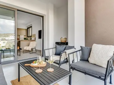 a living room with a table and a couch at Sanders Triple in Limassol