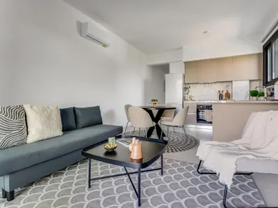 a living room with a couch and a table at Sanders Triple in Limassol